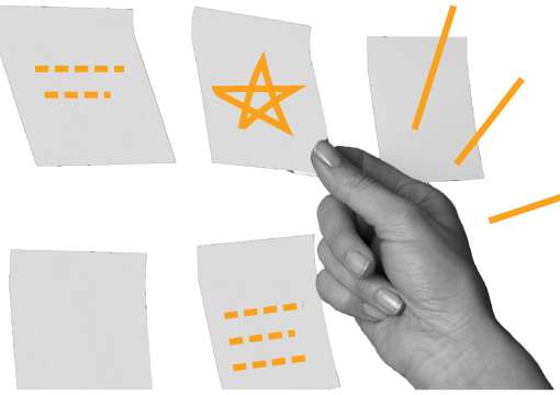 A hand pointing to various post-its